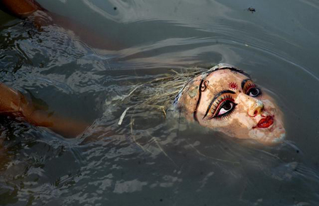 Durga Visarjan Face of Durga Idol in water